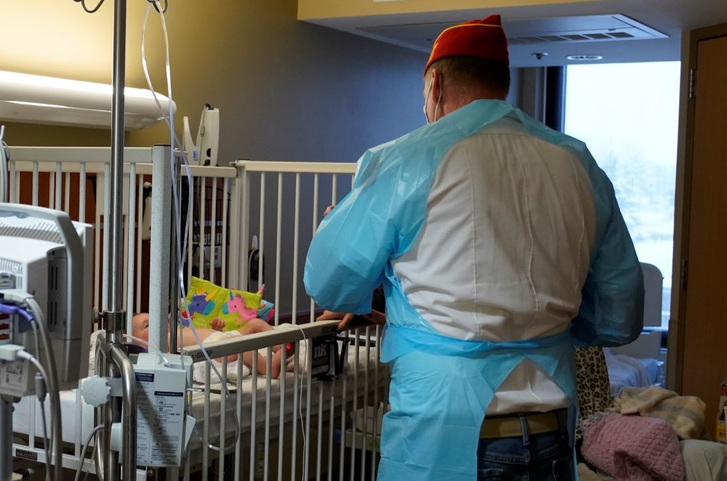 Marine Corp League delivering gift to baby small cropped