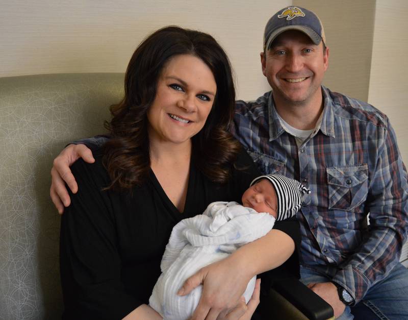 Laura and Javon Heathcote with their newborn Asher