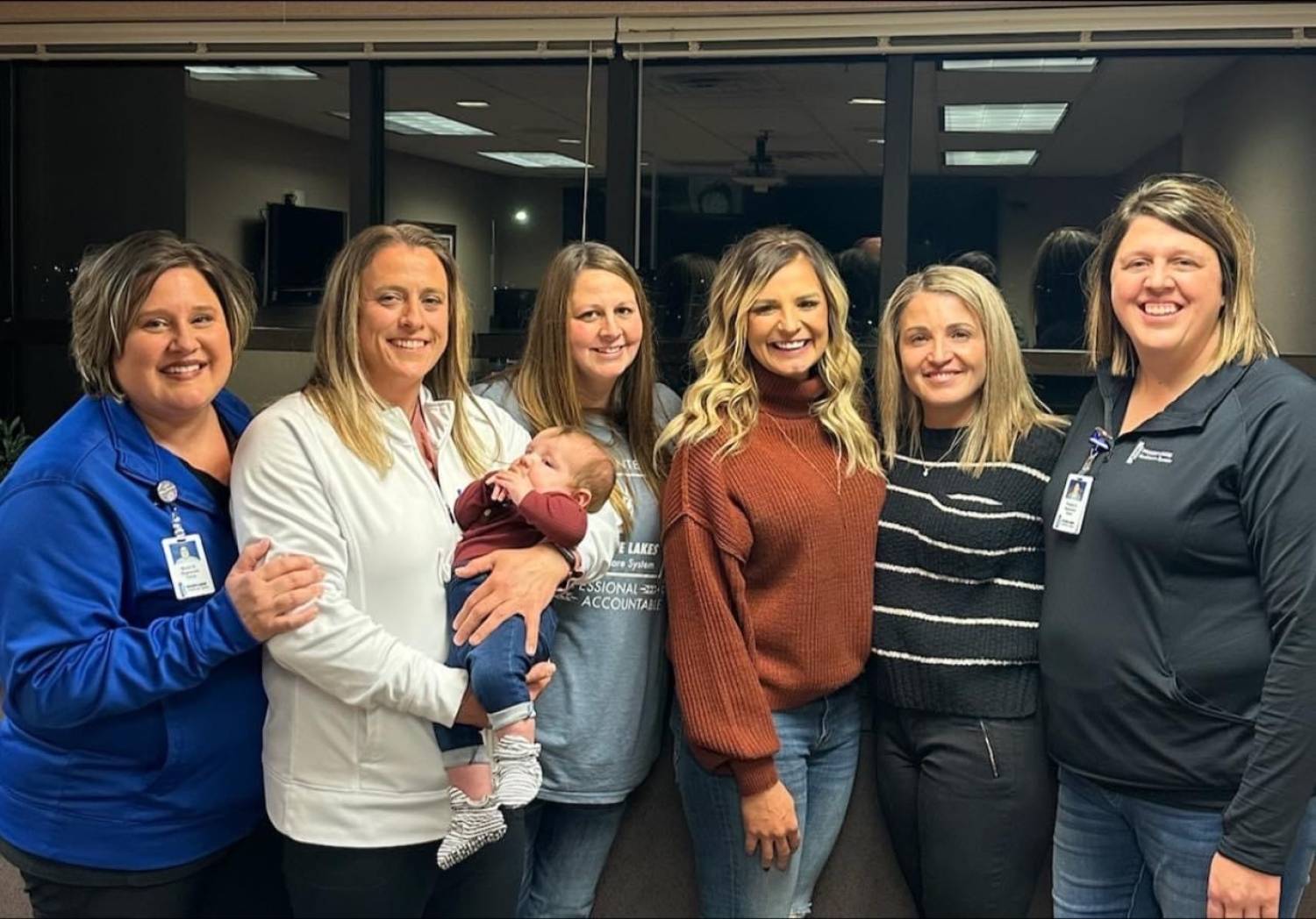 Prairie Lakes OB Nurses, Becki E., Rebecca S., Eryn M. and Nicole S. with Nicole Rislov, her new baby, and Dr. Pray-Dede