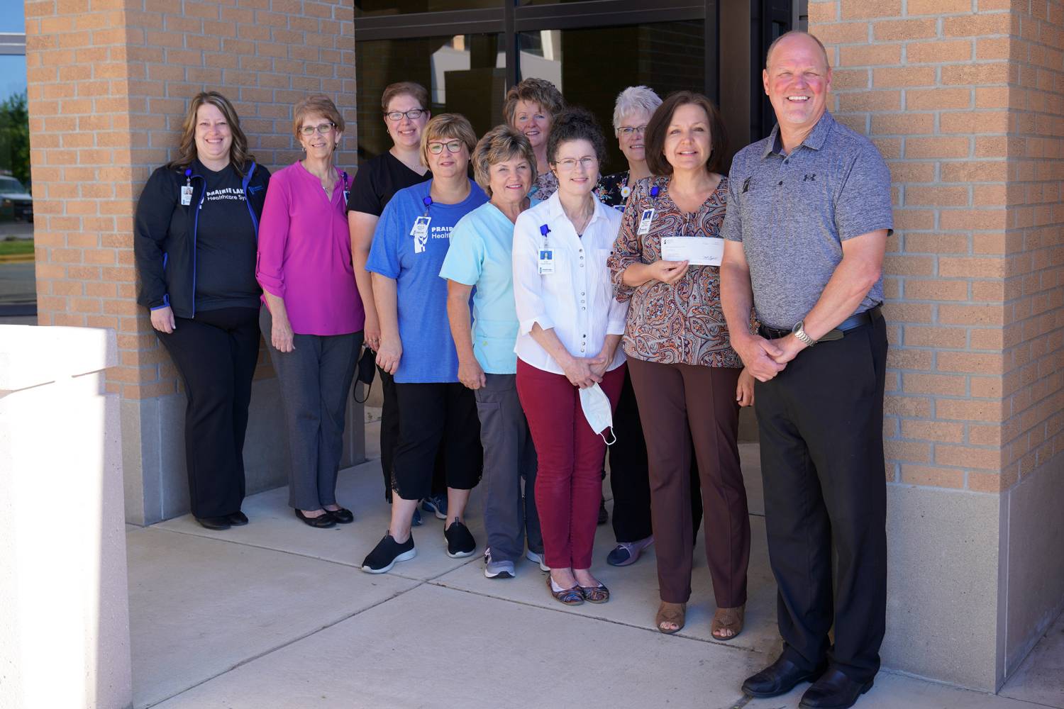 First Bank &amp; Trust President, Curt Trego, with Prairie Lakes Hospice Team