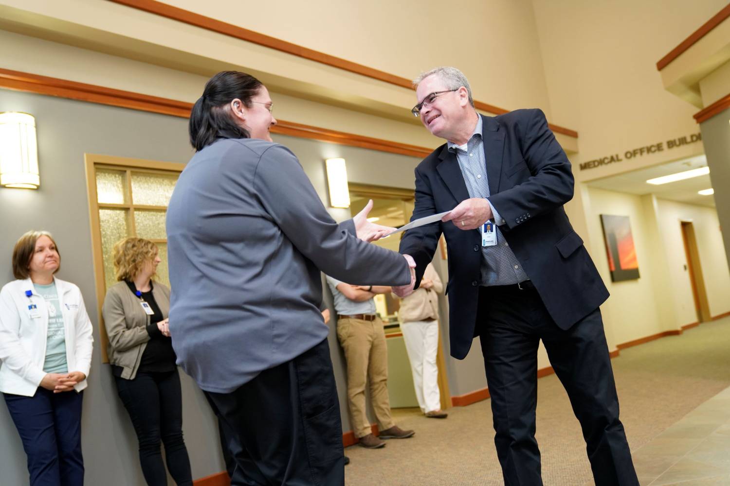 John Allen, PLHS CEO Distributing a Service Award