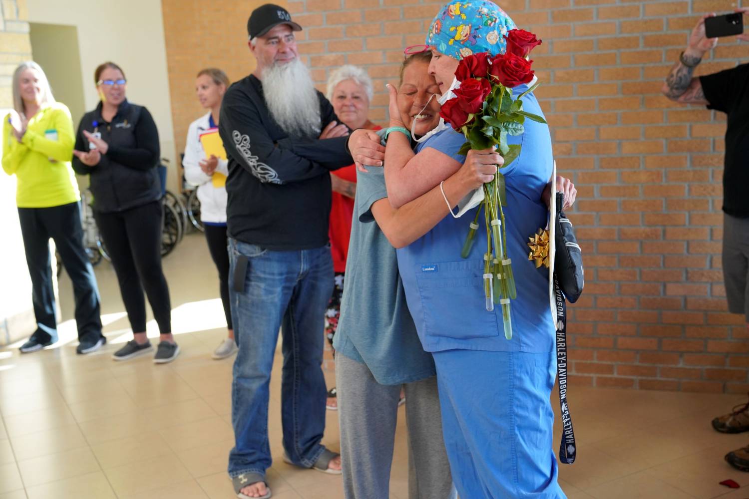 Stacey  Receives Hug From a Member of Her Care Team